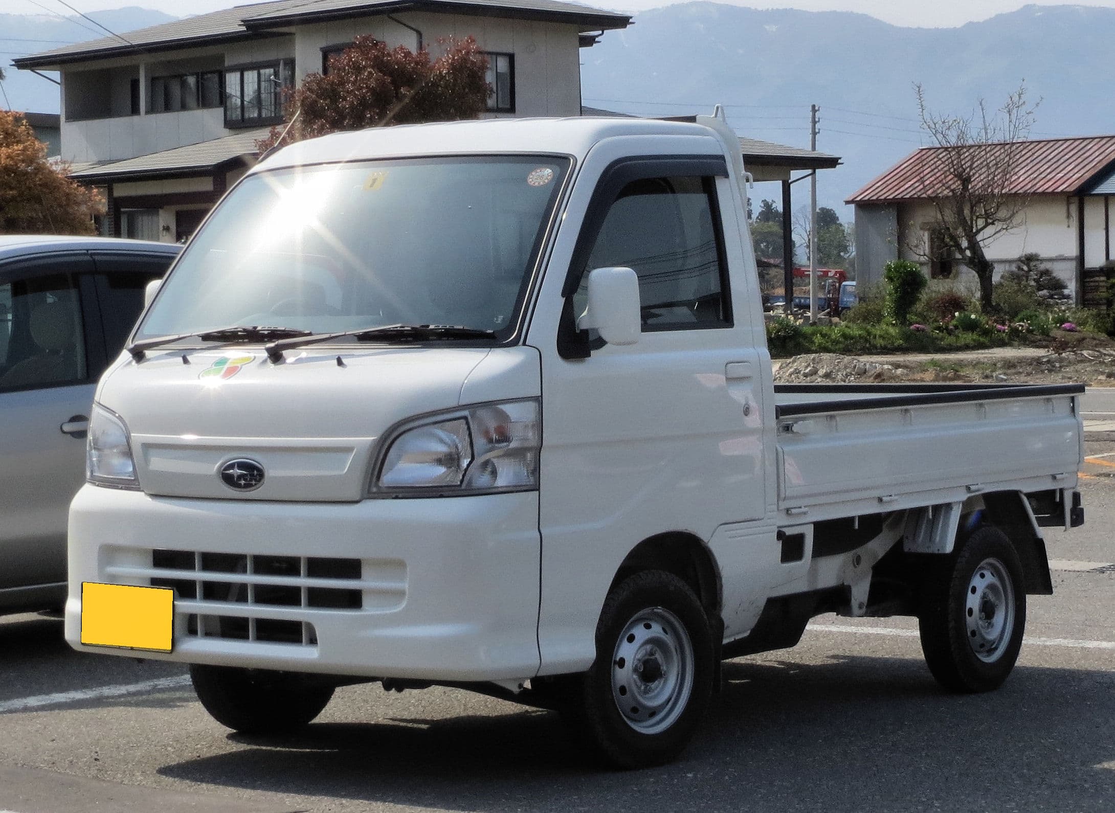 White Subaru Sambar Truck TC kei truck front three-quarter view