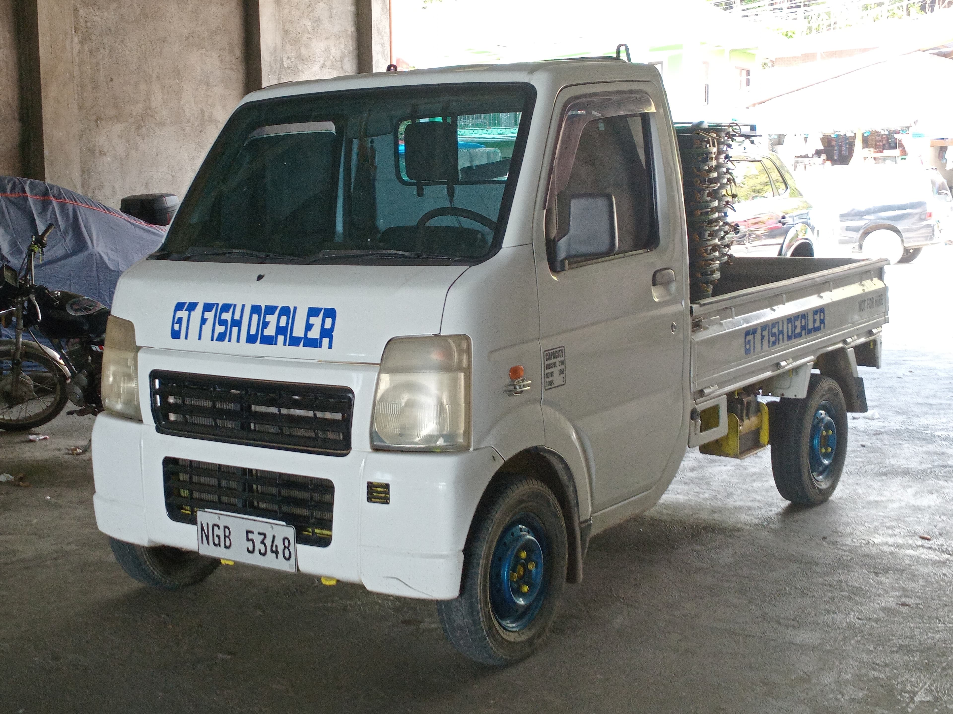 Suzuki Carry DA63T kei truck in outdoor setting